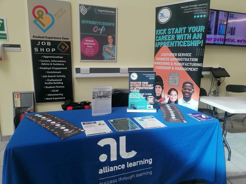 An Alliance Learning stand at a school event